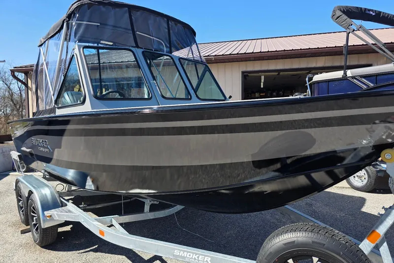 Slide: The Image of 2026 Smoker Craft Avenger 188 HD Pro boat on trailer, featuring sleek black design. - 1