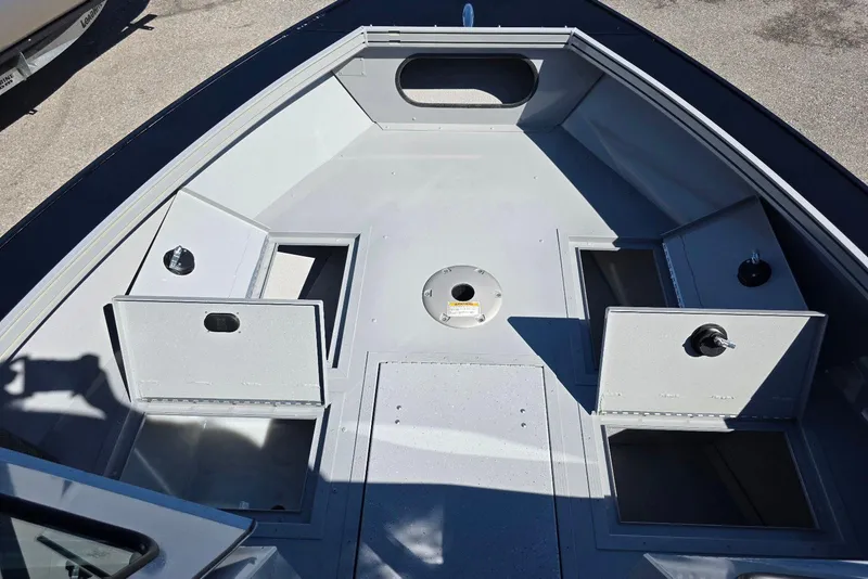Slide: The Image of 2026 Smoker Craft Avenger 188 HD Pro boat interior with open storage compartments. - 11