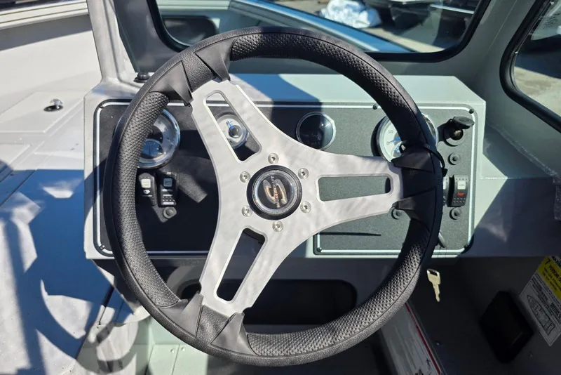 Slide: The Image of Steering wheel of 2026 Smoker Craft Avenger 188 HD Pro boat cockpit. - 16