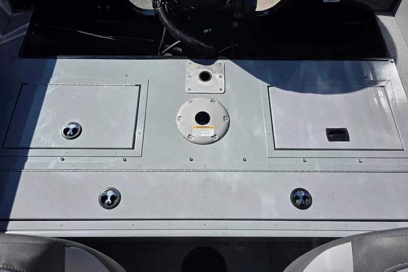 Slide: The Image of 2026 Smoker Craft Avenger 188 HD Pro boat deck with storage compartments and seat base. - 20