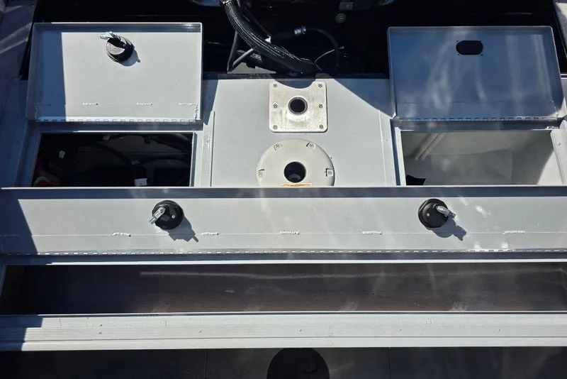 Slide: The Image of 2026 Smoker Craft Avenger 188 HD Pro boat interior with storage compartments and fixtures. - 21