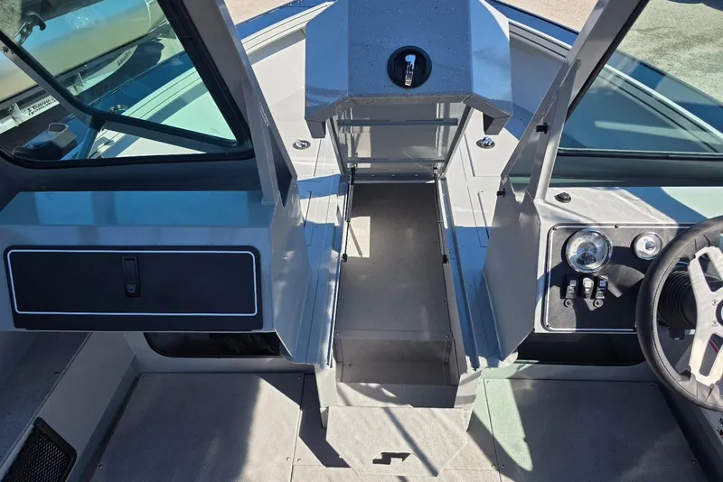 Slide: The Image of 2026 Smoker Craft Avenger 188 HD Pro boat interior with steering wheel and dashboard controls. - 9