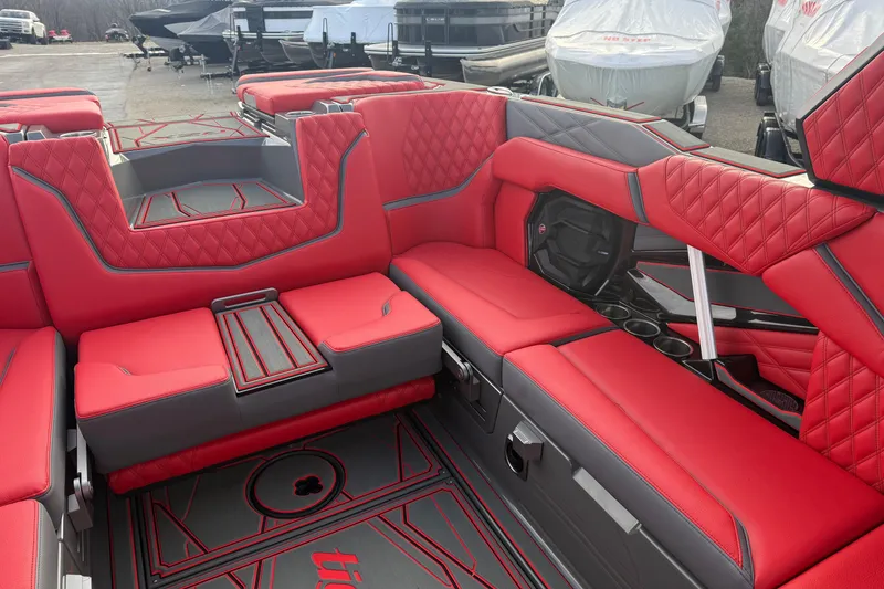 Slide: The Image of Luxurious red interior of 2026 Tigé 24RZX boat with quilted seating. - 12