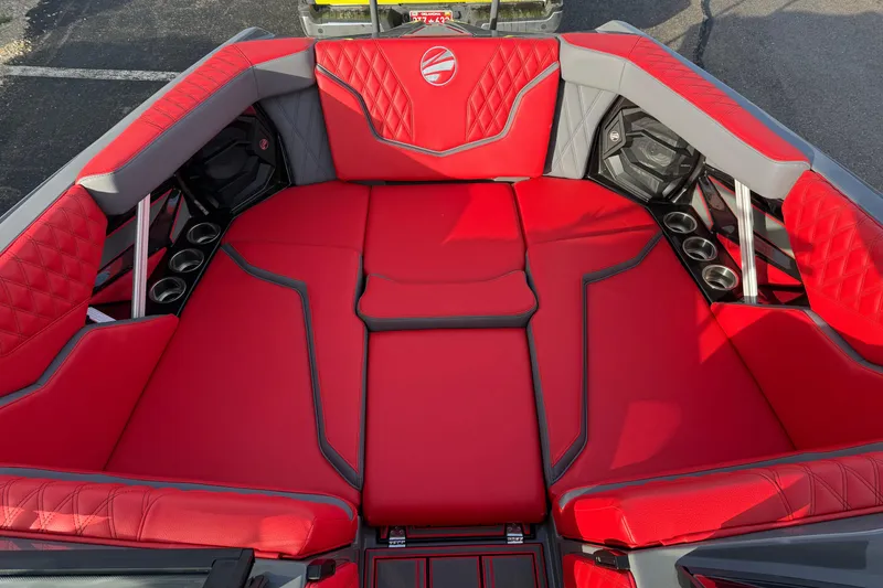 Slide: The Image of 2026 Tigé 24RZX boat interior with red and gray seating, cup holders, and stylish design. - 15
