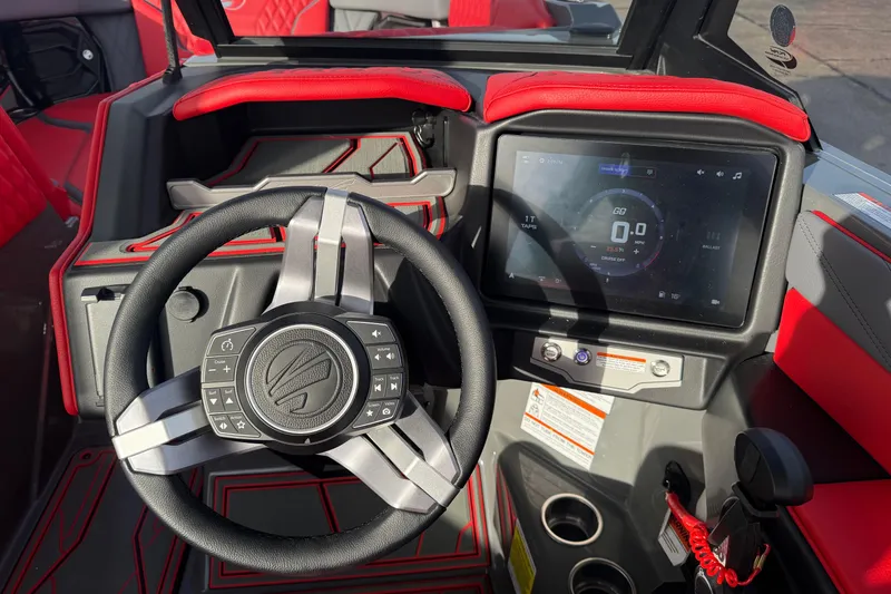 Slide: The Image of 2026 Tigé 24RZX boat dashboard with steering wheel and touchscreen display. - 17