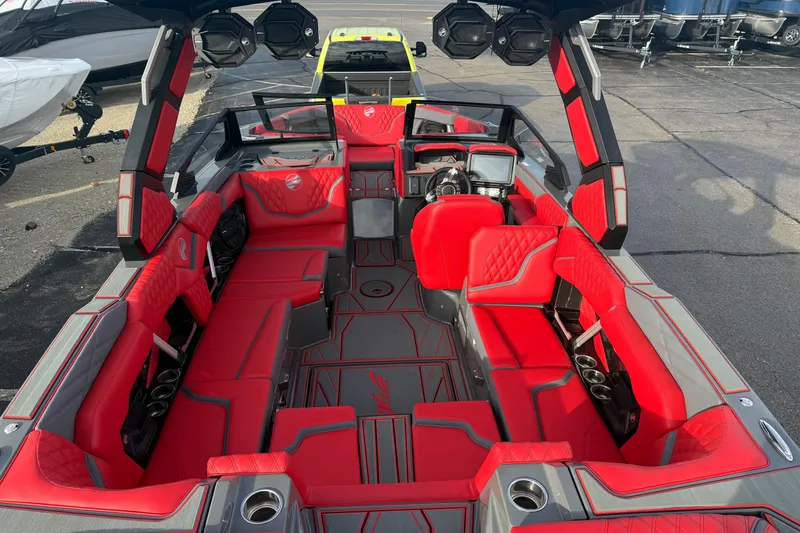 Slide: The Image of 2026 Tigé 24RZX boat interior with red upholstery and modern design. - 19