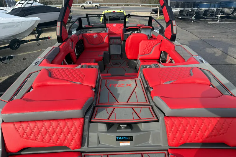 Slide: The Image of 2026 Tigé 24RZX boat interior with vibrant red and gray seating, showcasing luxury design. - 20
