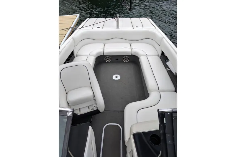 Slide: The Image of 2003 Malibu Wakesetter 23 LSV boat interior with white seating and gray flooring. - 3