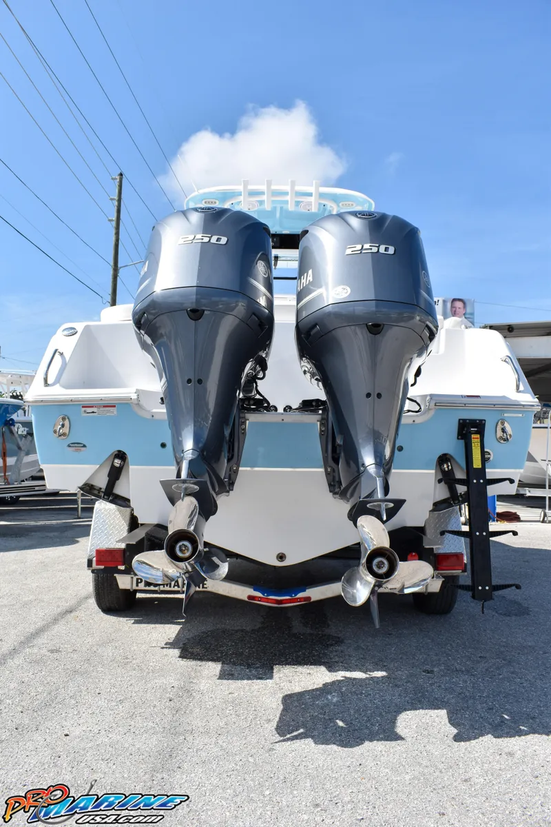 Slide: The Image of Rear view of 2019 Sea Hunt Ultra 275 SE with twin outboard engines. - 11