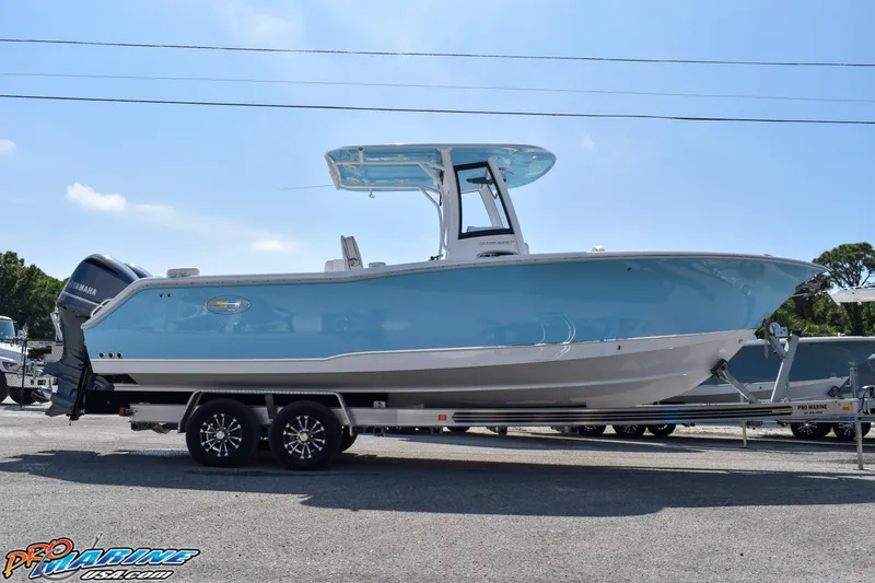 Slide: The Image of 2019 Sea Hunt Ultra 275 SE boat on trailer, side view. - 13