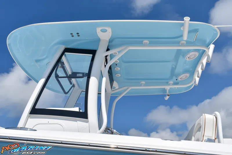 Slide: The Image of 2019 Sea Hunt Ultra 275 SE boat with blue canopy. - 16