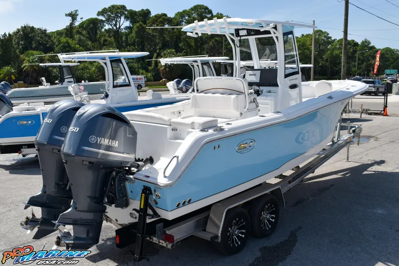 Slide: The Image of 2019 Sea Hunt Ultra 275 SE boat with Yamaha engines on trailer. - 19