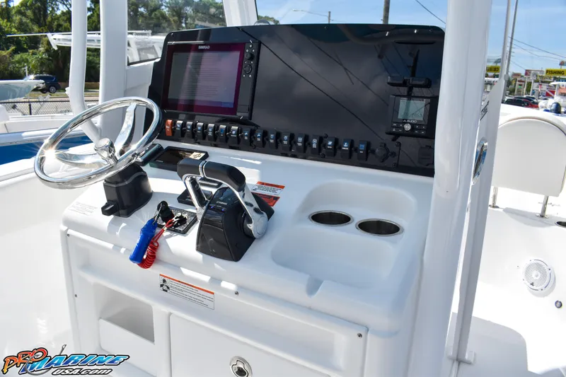 Slide: The Image of 2019 Sea Hunt Ultra 275 SE boat console with controls. - 27