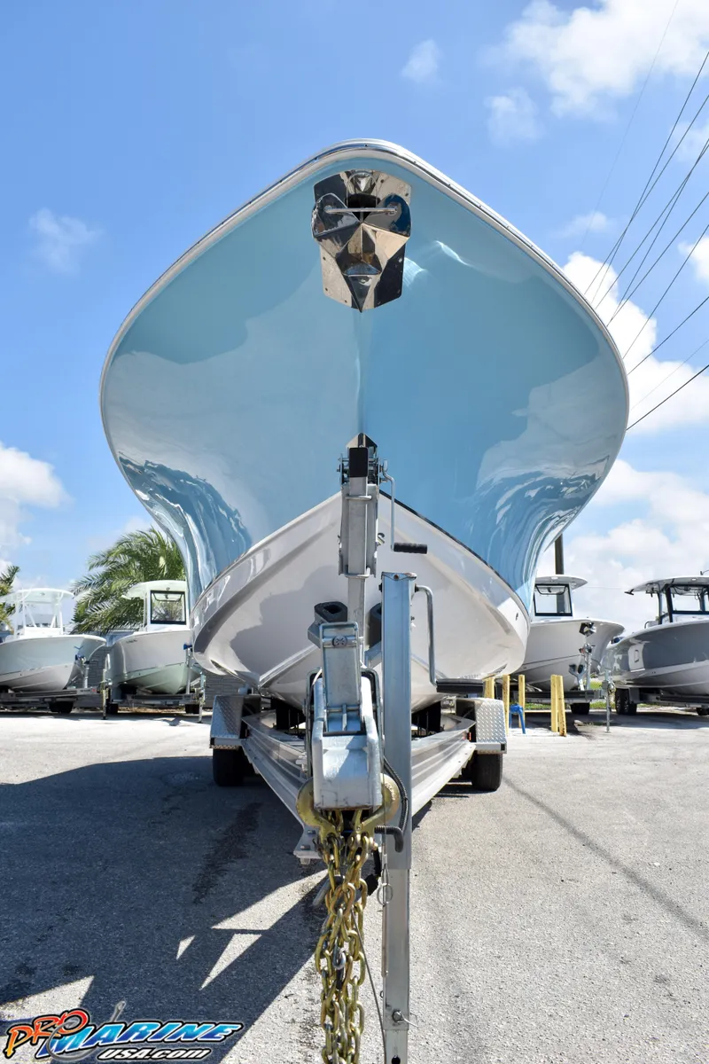 Slide: The Image of 2019 Sea Hunt Ultra 275 SE boat on trailer, blue sky. - 6