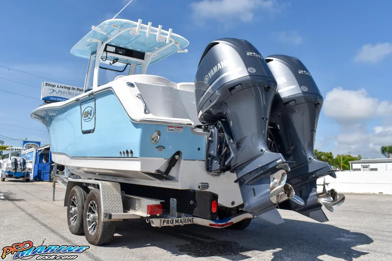 Slide: The Image of 2019 Sea Hunt Ultra 275 SE with dual outboard engines. - 8