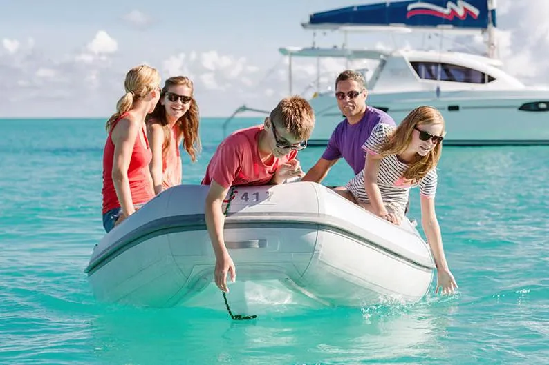 Slide: The Image of Manufacturer Provided Image: Group on AB Inflatables Navigo 10 VS in clear water. - 2