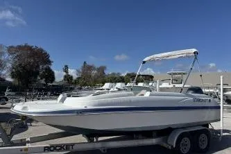 The Image of 2017 Starcraft 2000 OB Limited boat on trailer under clear blue sky. - 1