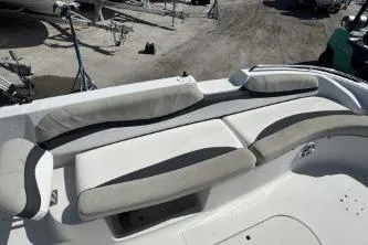 Slide: The Image of 2017 Starcraft 2000 OB Limited boat seating area with gray and white upholstery. - 11