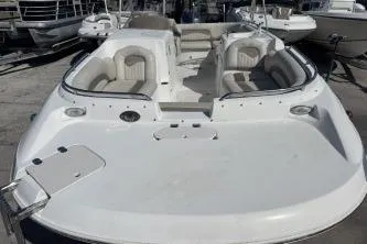 Slide: The Image of 2017 Starcraft 2000 OB Limited boat with spacious seating, docked outdoors. - 13