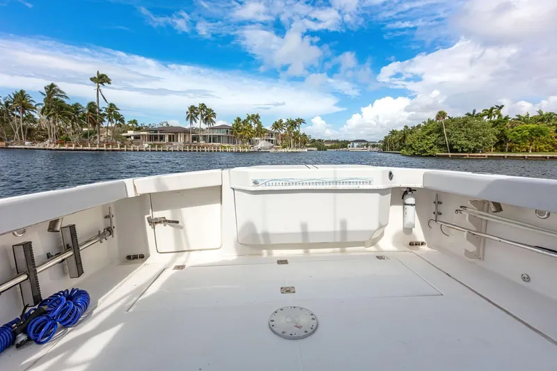 Slide: The Image of 2000 Rampage 30 Express boat deck with scenic waterfront view. - 19