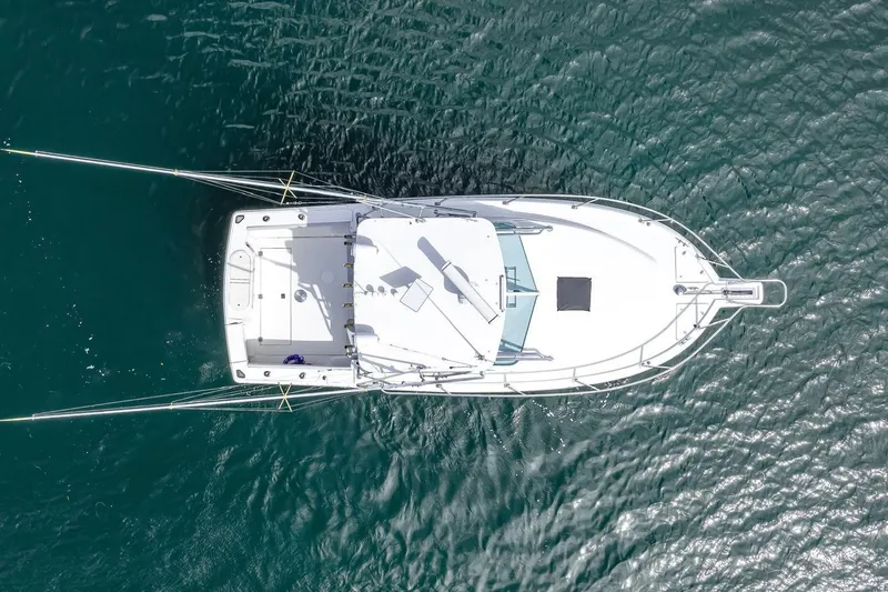 Slide: The Image of Overhead view of 2000 Rampage 30 Express boat on clear blue water. - 7