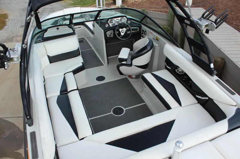 Slide: The Image of 2012 Moomba Mojo 2.5 boat interior with sleek seating and modern dashboard design. - 11