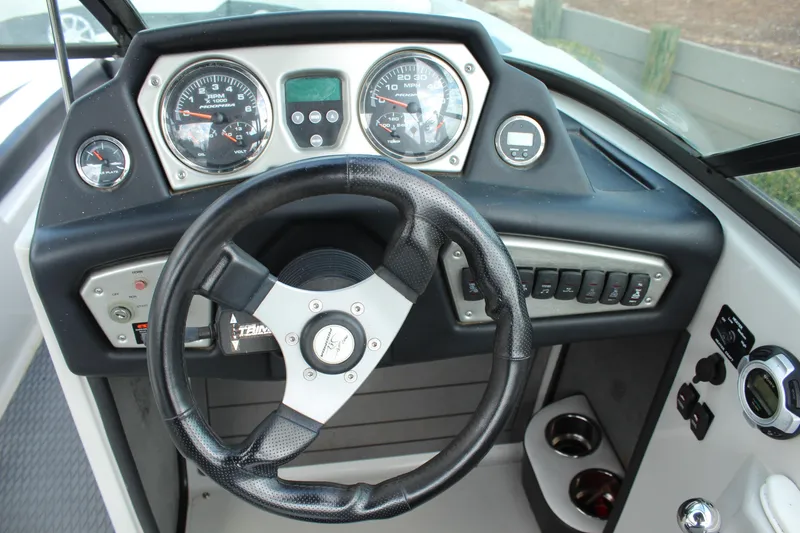 Slide: The Image of 2012 Moomba Mojo 2.5 dashboard with steering wheel and instrument panel. - 13