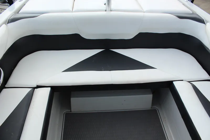 Slide: The Image of 2012 Moomba Mojo 2.5 boat interior with black and white seating. - 14