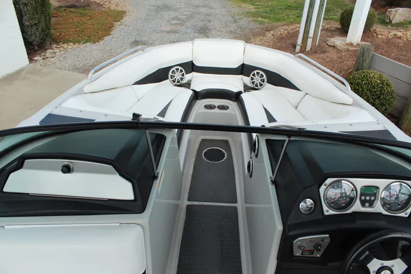 Slide: The Image of 2012 Moomba Mojo 2.5 boat interior with white seating and dashboard view. - 15