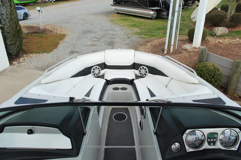 Slide: The Image of 2012 Moomba Mojo 2.5 boat interior with white seating and dashboard view. - 16