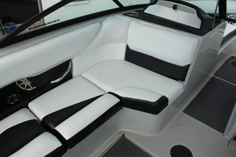 Slide: The Image of 2012 Moomba Mojo 2.5 boat interior with white and black seating. - 19