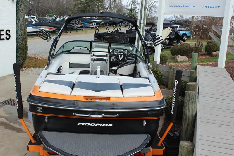 Slide: The Image of 2012 Moomba Mojo 2.5 boat with orange and black accents, displayed at Charlotte Ski Boats. - 5