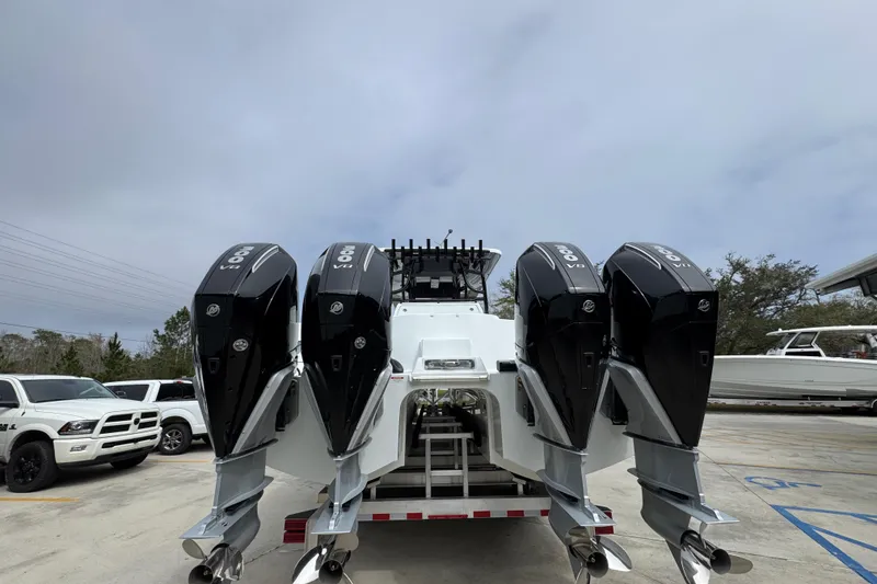 Slide: The Image of 2026 Invincible 38 Catamaran with quad outboard engines on a trailer. - 14