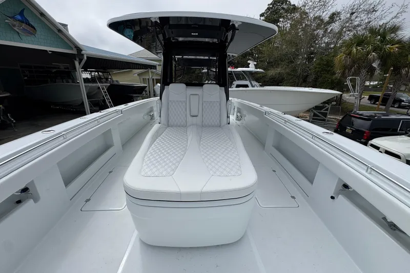 Slide: The Image of 2026 Invincible 38 Catamaran with sleek white seating and modern design. - 20