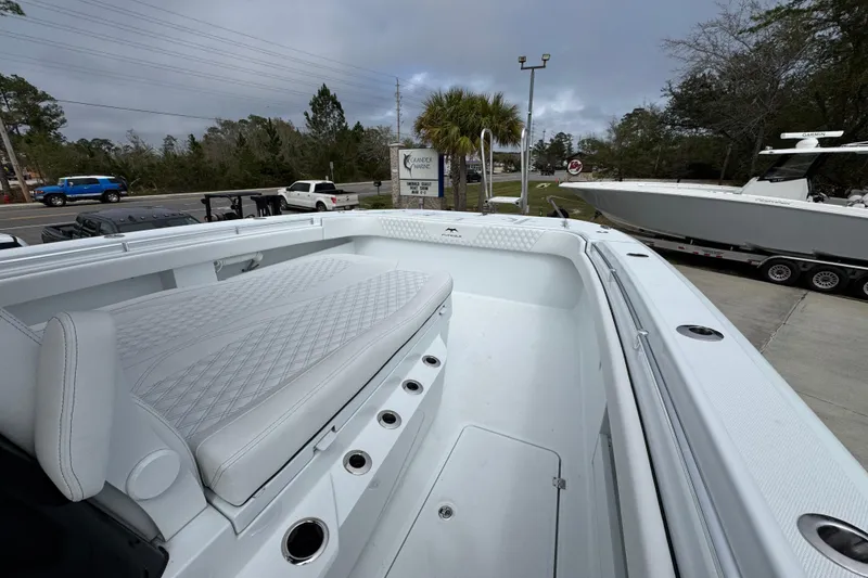 Slide: The Image of 2026 Invincible 38 Catamaran with sleek white seating and spacious deck. - 21