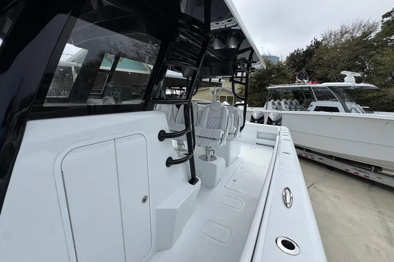 Slide: The Image of 2026 Invincible 38 Catamaran with sleek design and modern seating on display. - 24