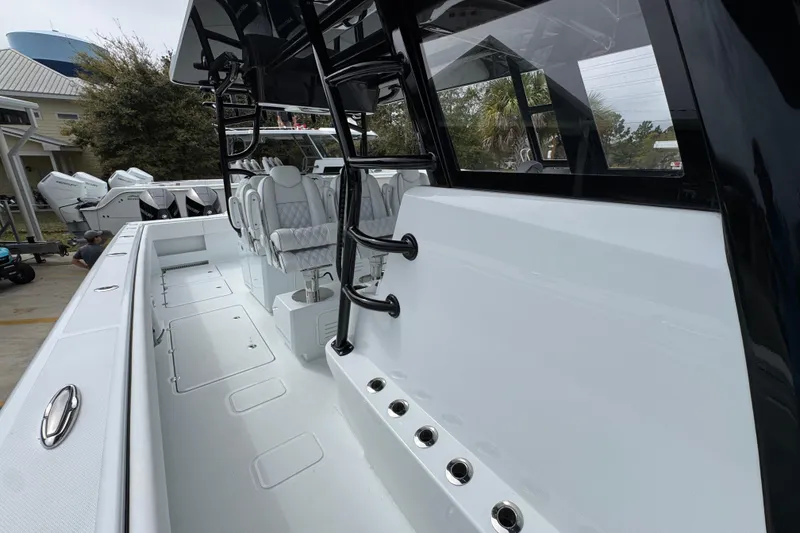 Slide: The Image of 2026 Invincible 38 Catamaran with sleek design and modern seating arrangement. - 25