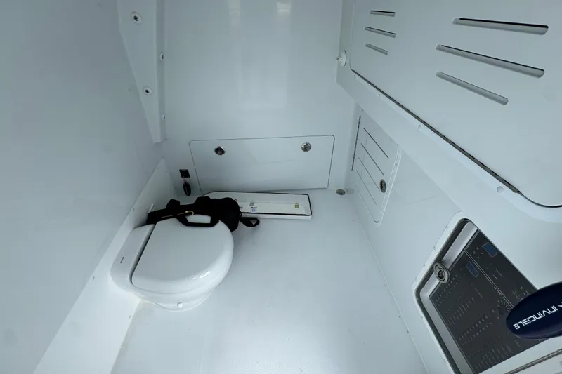 Slide: The Image of 2026 Invincible 38 Catamaran interior with toilet and control panel. - 27
