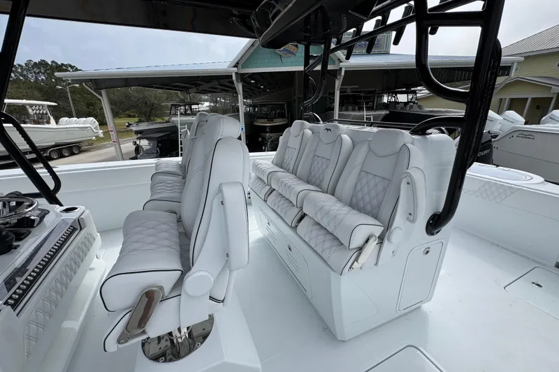 Slide: The Image of 2026 Invincible 38 Catamaran interior with luxurious white seating and modern design. - 32