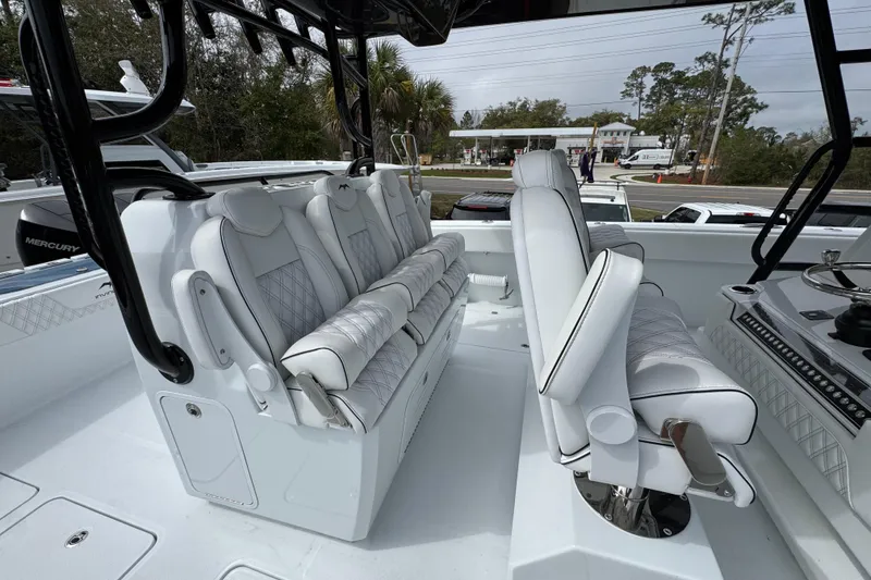 Slide: The Image of 2026 Invincible 38 Catamaran interior with luxurious white seating and modern design. - 33