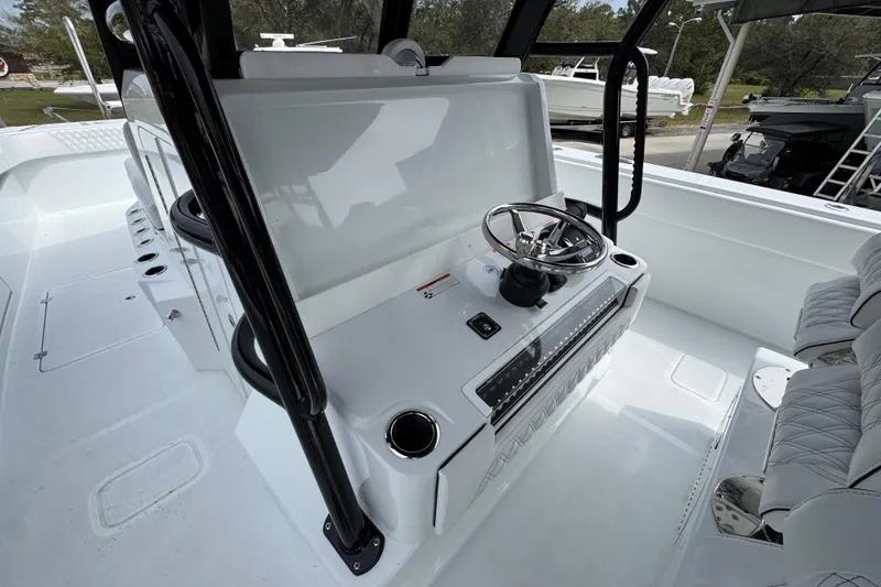 Slide: The Image of 2026 Invincible 38 Catamaran helm with modern steering and seating. - 34