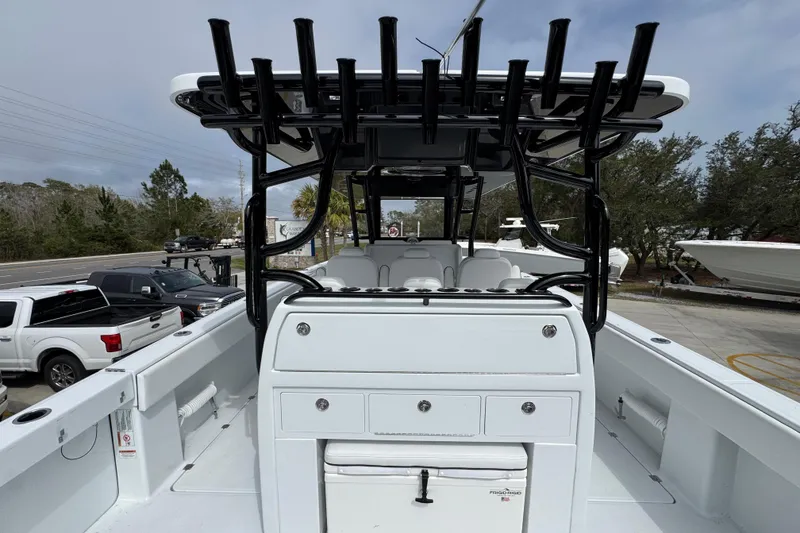 Slide: The Image of 2026 Invincible 38 Catamaran with spacious deck and rod holders, parked outdoors. - 40