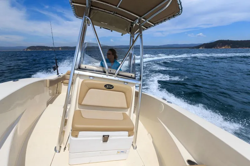 Slide: The Image of Manufacturer Provided Image: 2023 Scout 195 Sportfish boat cruising on open water. - 14
