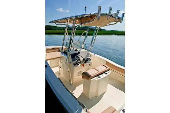 Slide: The Image of Manufacturer Provided Image: 2023 Scout 195 Sportfish boat with center console and T-top on calm water. - 16