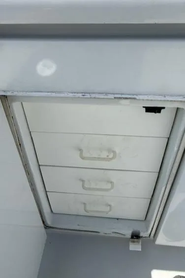 Slide: The Image of Storage drawers on a 2002 Hatteras 55 Convertible boat. - 19