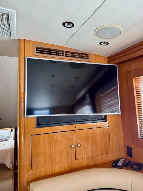 Slide: The Image of Interior of 2002 Hatteras 55 Convertible yacht with mounted flat-screen TV. - 47