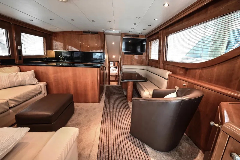 Slide: The Image of Luxurious interior of 2002 Hatteras 55 Convertible yacht with elegant wood finishes. - 48