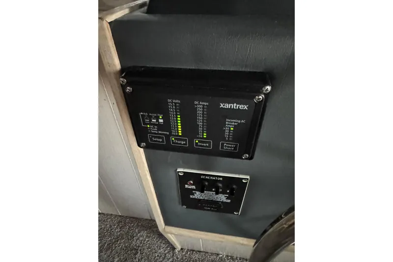 Slide: The Image of Control panel on a 1996 Gibson 50 Cabin Yacht, featuring Xantrex inverter display. - 34