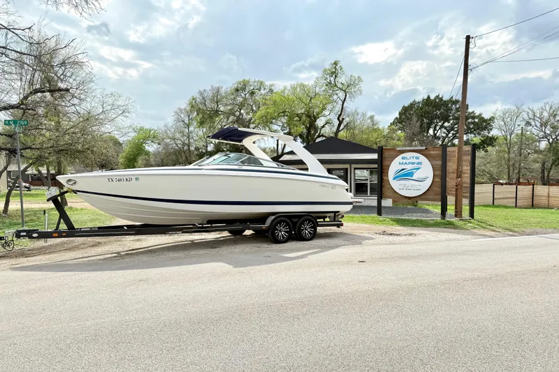 The Image of 2005 Cobalt 262 boat on trailer outside Elite Marine dealership. - 1