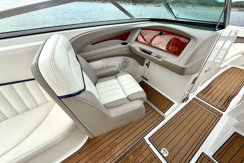 Slide: The Image of Interior of a 2005 Cobalt 262 boat with luxurious seating and wood flooring. - 25